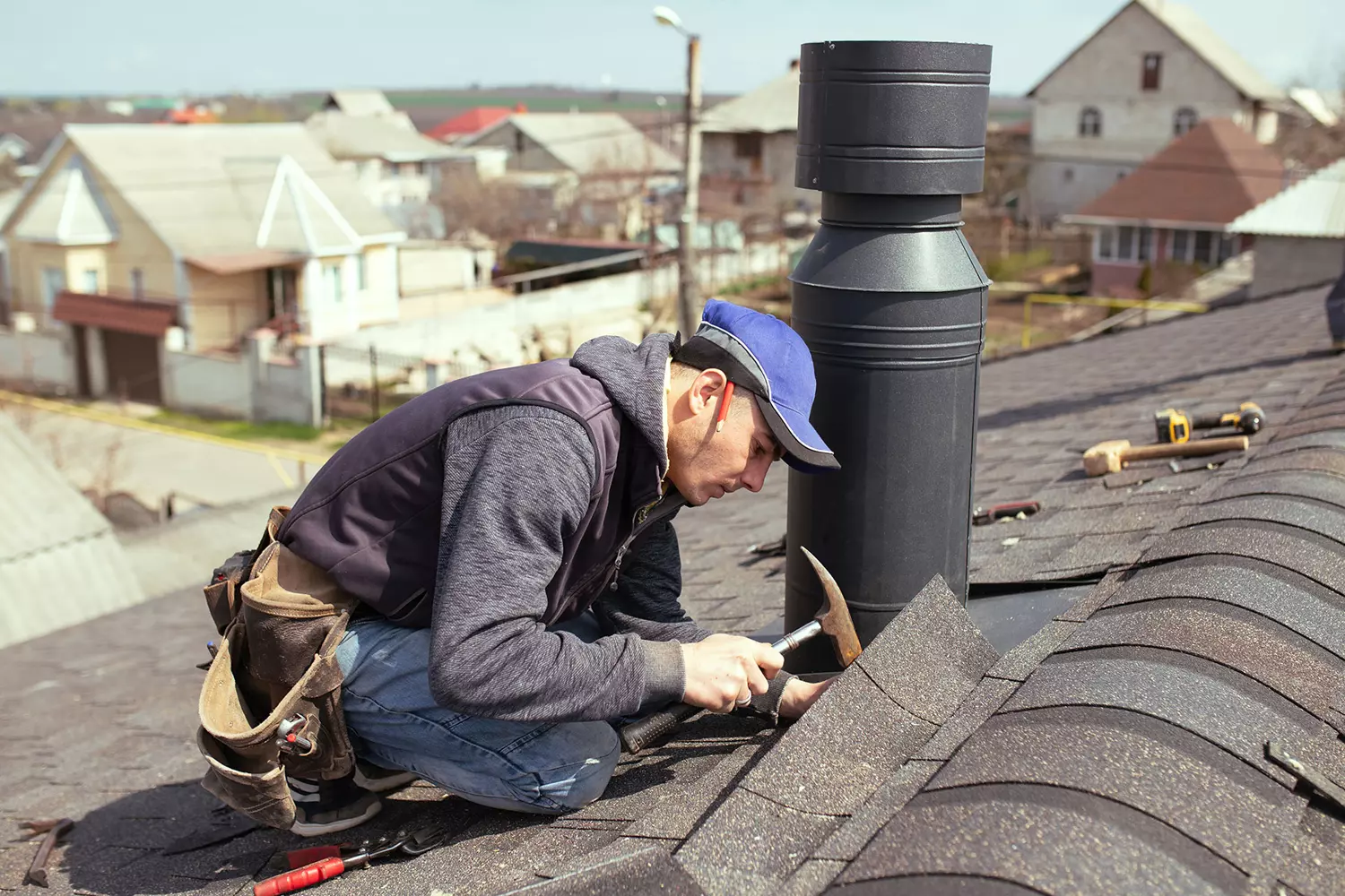 Roofer completing a roof repair